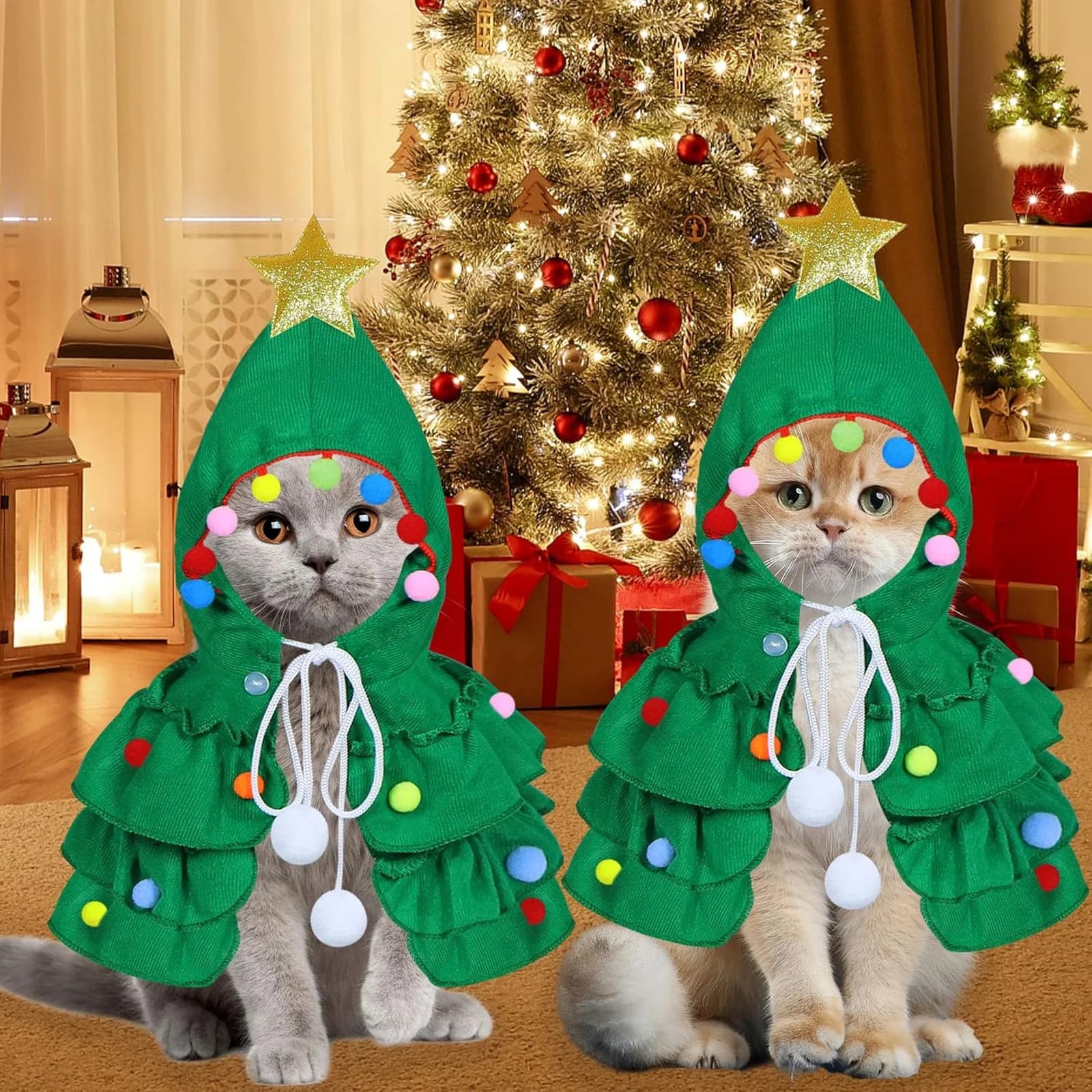 Two cats in the green tree costume by a lit Christmas tree